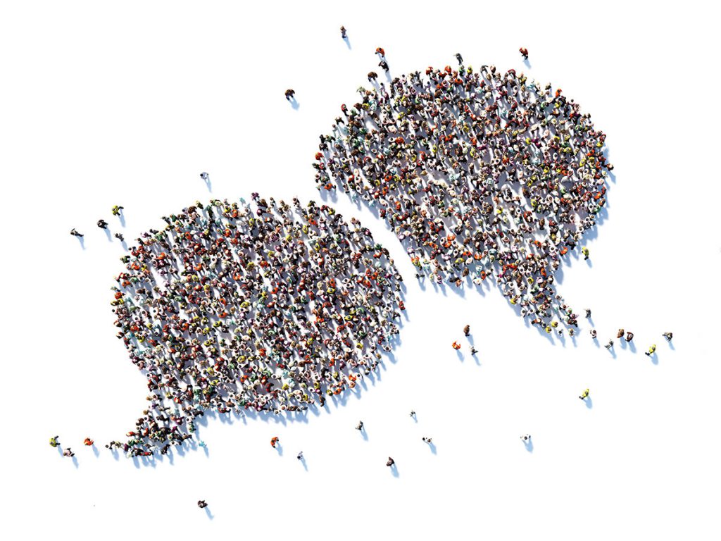 Crowd of people forming two speech bubbles
